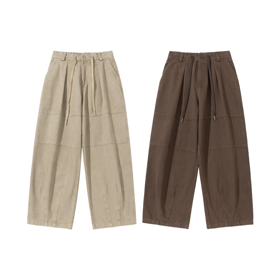 Two pairs of wide-leg trousers shown from the front in light beige and dark brown, with pleats and drawstrings.
