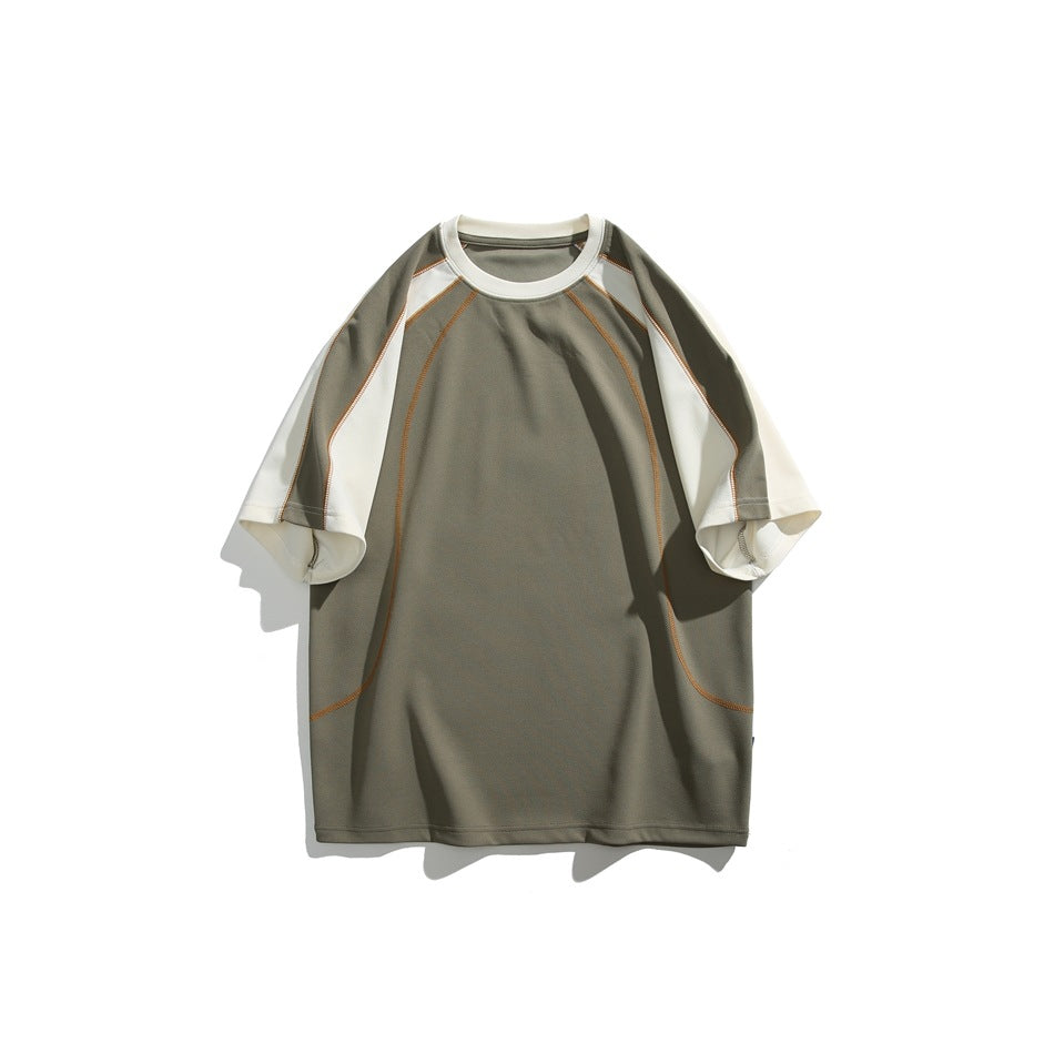 Green short-sleeve raglan T-shirt with cream sleeves, cream neckband and orange contrast stitching, flat front view