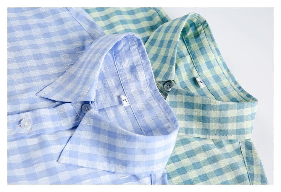 Close-up of collars and plackets on blue gingham and teal-and-yellow gingham shirts.