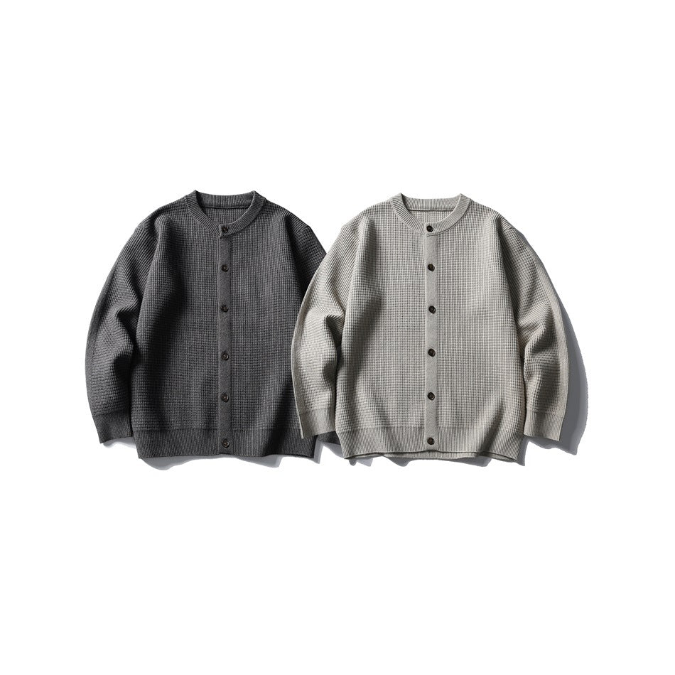Two button-front knit cardigans shown from the front: one charcoal gray and one light gray.