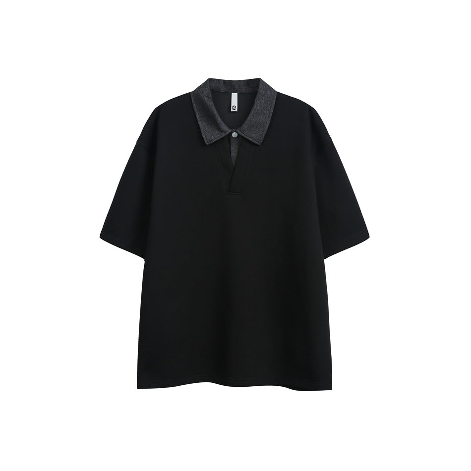 Black short-sleeve polo top with gray denim-look collar and V placket with snap button, flat front view