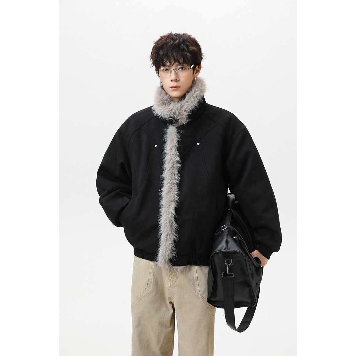 Model wearing a black oversized jacket with a plush light gray fur collar and front trim.
