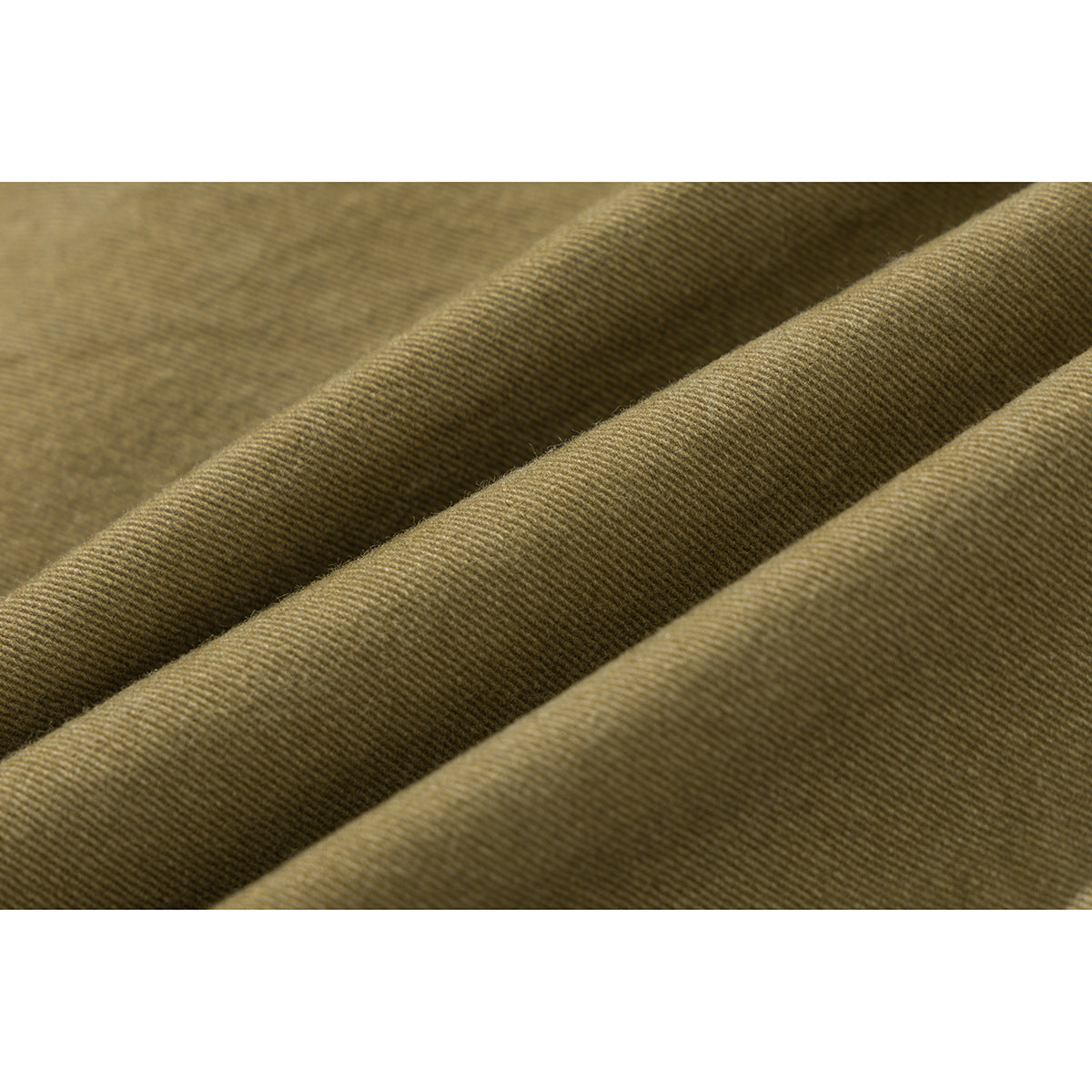Macro view of the olive-colored fabric folded to show its surface texture.