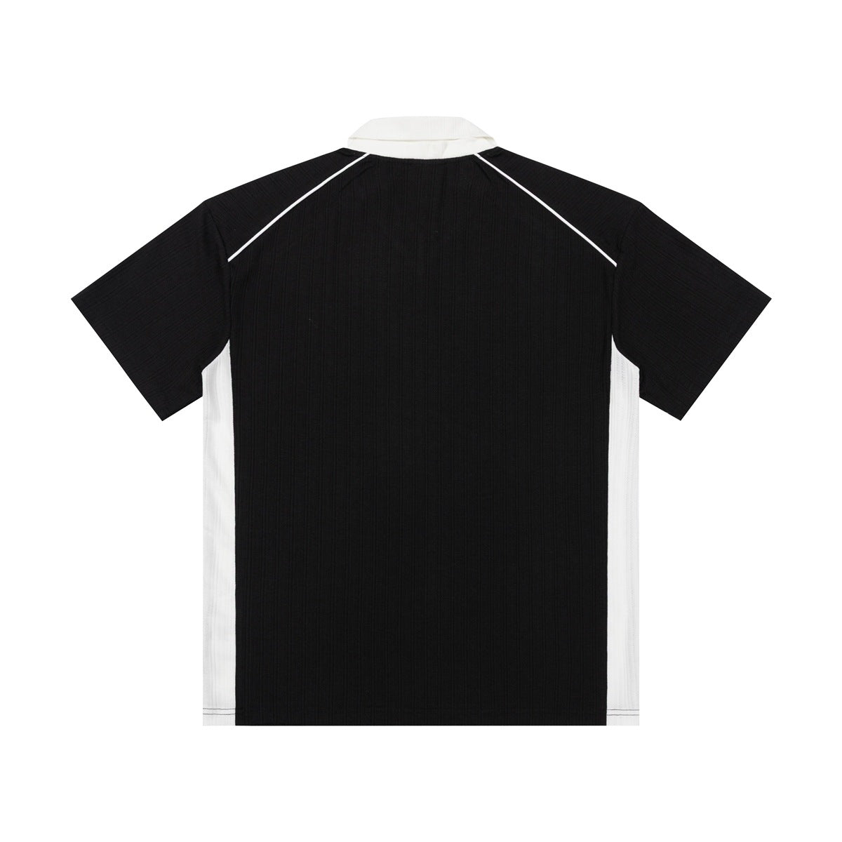 Back view of a black short-sleeve collared shirt with white side panels and piping.