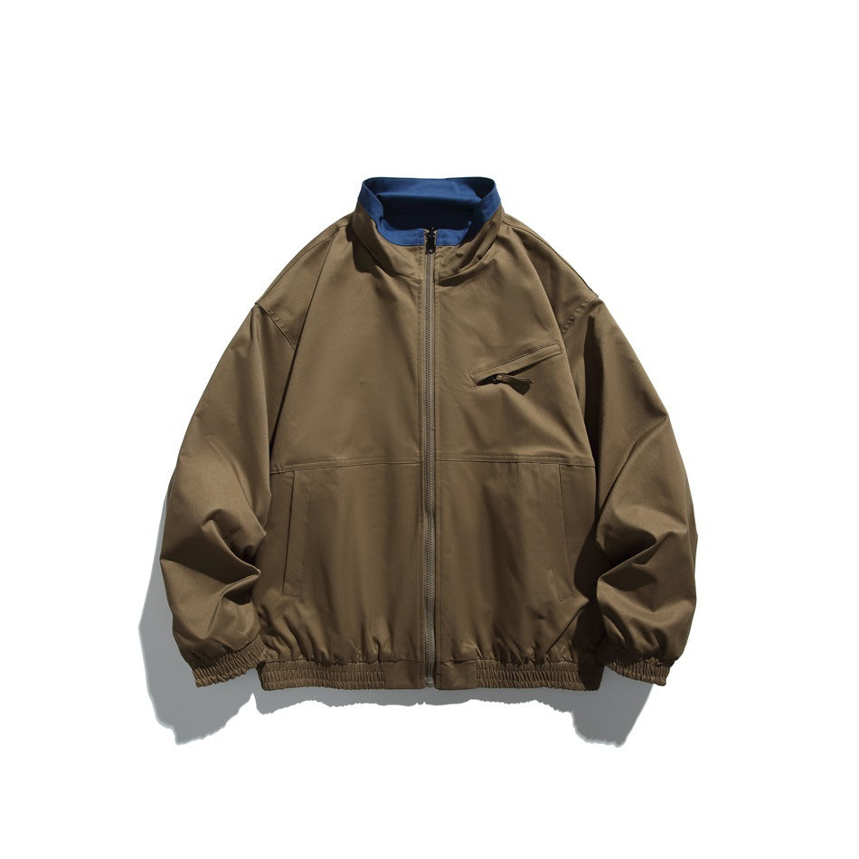 Khaki zip-front stand-collar jacket with blue inner collar, chest zip pocket and elastic cuffs and hem