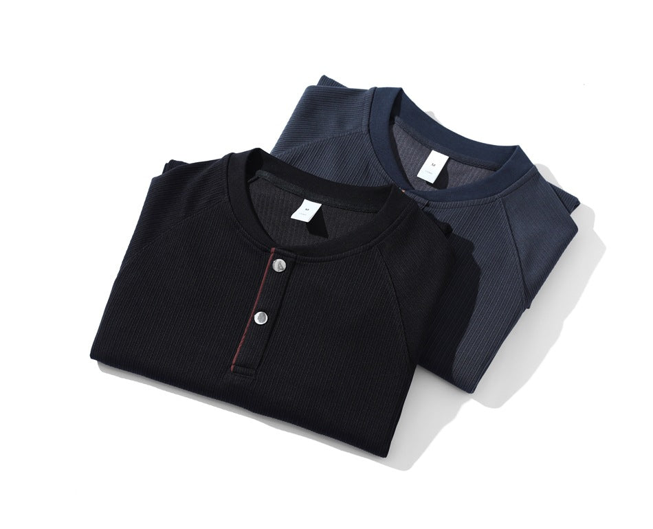 Two folded ribbed Henley shirts in black and slate blue, each with a two-button placket.