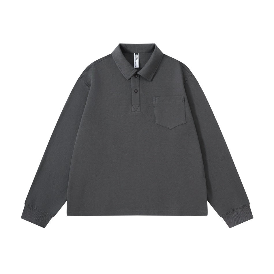 Dark gray long-sleeve polo-collar top with ribbed cuffs and chest patch pocket, flat lay front view