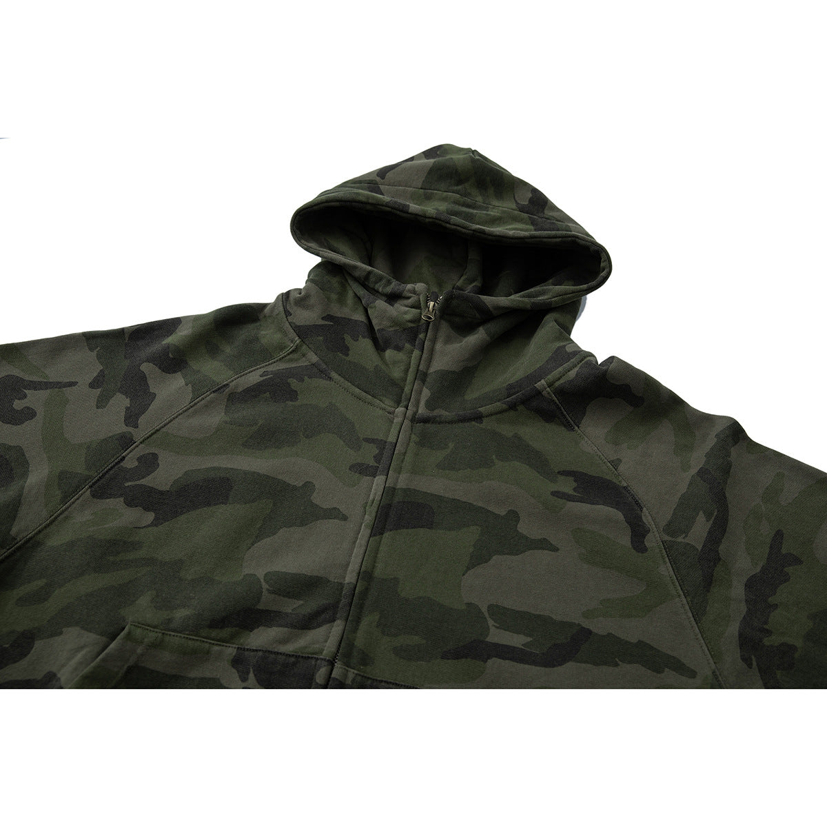 Close-up of a dark green camouflage zip hoodie showing its hood, zipper, and raglan seams.