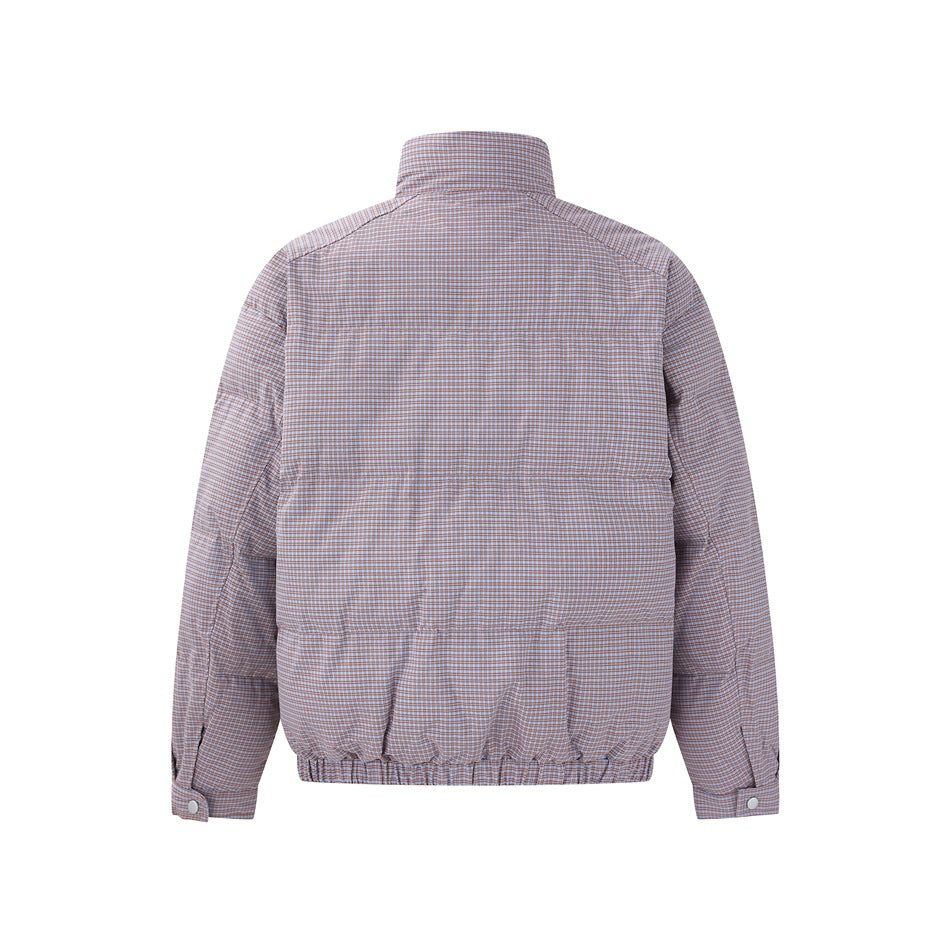 Back view of a long-sleeve jacket in a fine brown, blue, and white check, with a gathered hem and buttoned cuffs.