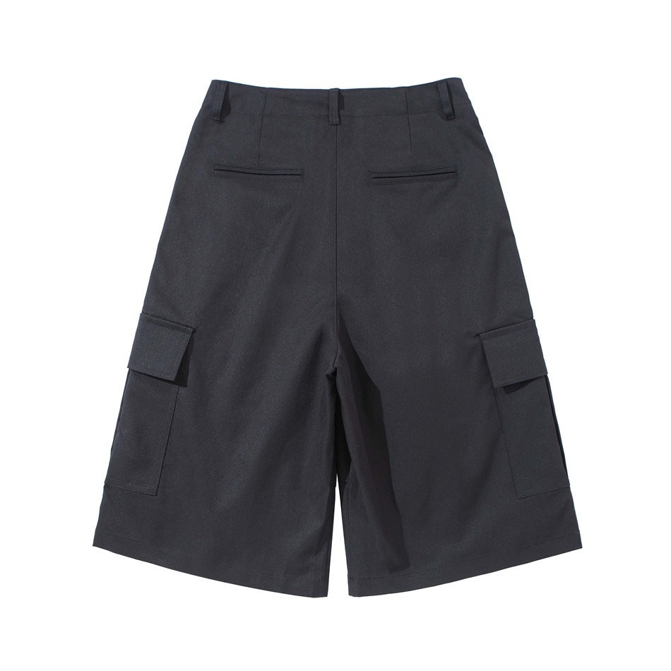 Back view of dark charcoal cargo shorts with two welt pockets and flap cargo pockets.