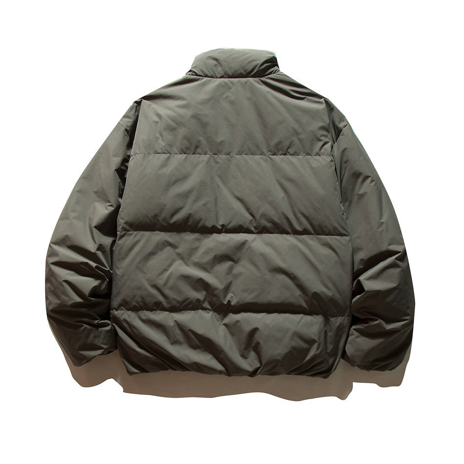 Back view of a dark charcoal jacket with a stand collar, long sleeves, and horizontal padded sections.