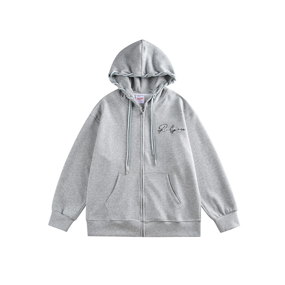 Gray zip-front hoodie flat lay with blue-gray drawstrings, kangaroo pocket and chest embroidery