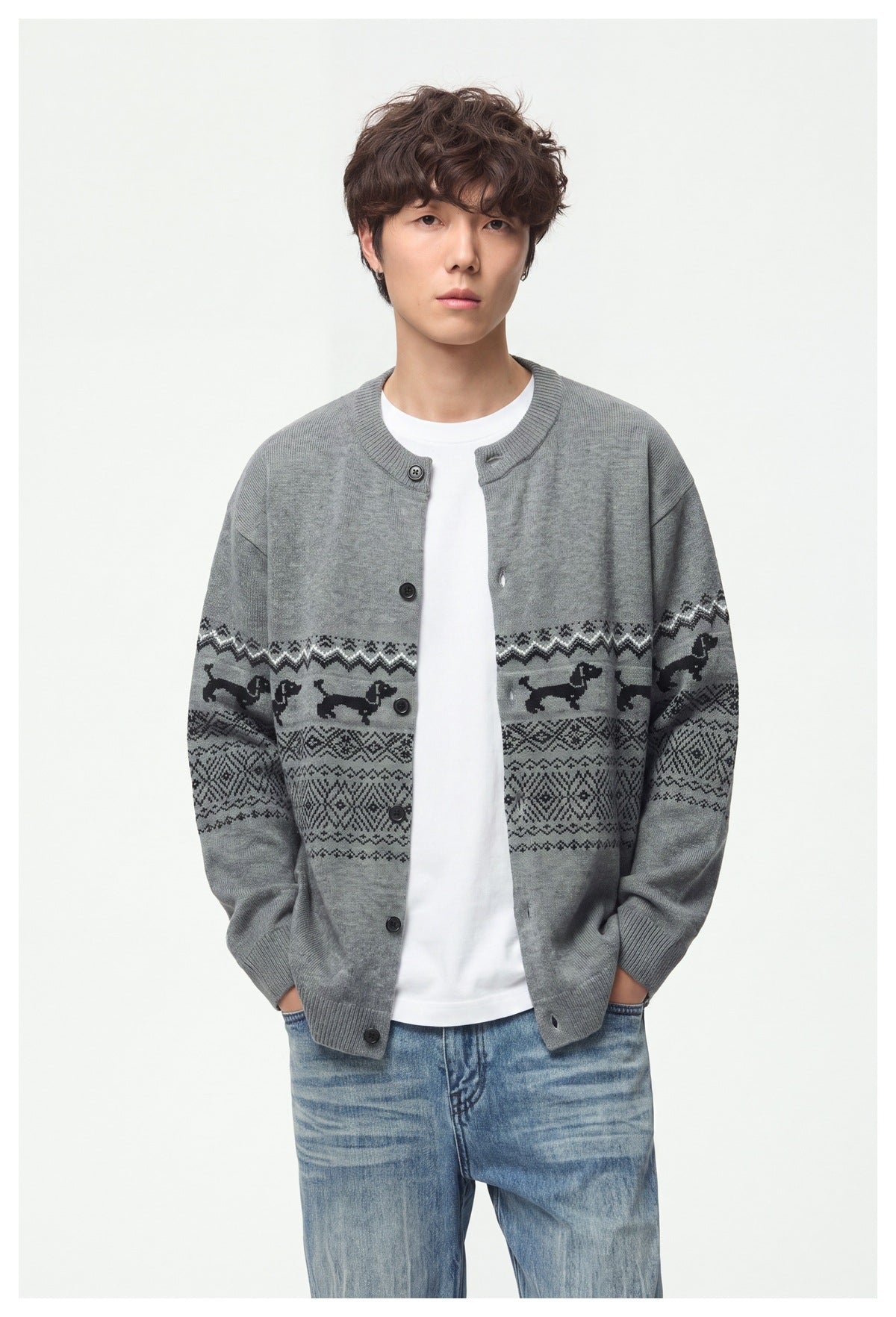 Front view of a model wearing a gray cardigan with black dog motifs and geometric bands across the body and sleeves.