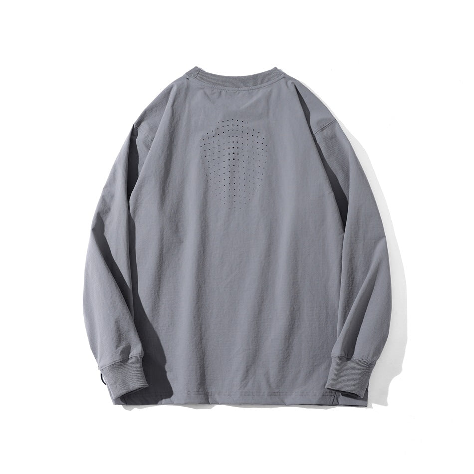 Back view of a gray long-sleeve crewneck shirt laid flat, with a dotted oval detail across the upper back.