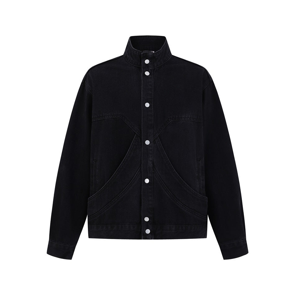 Front view of a black jacket with a stand collar, silver snap buttons, curved seams, and large front pockets.