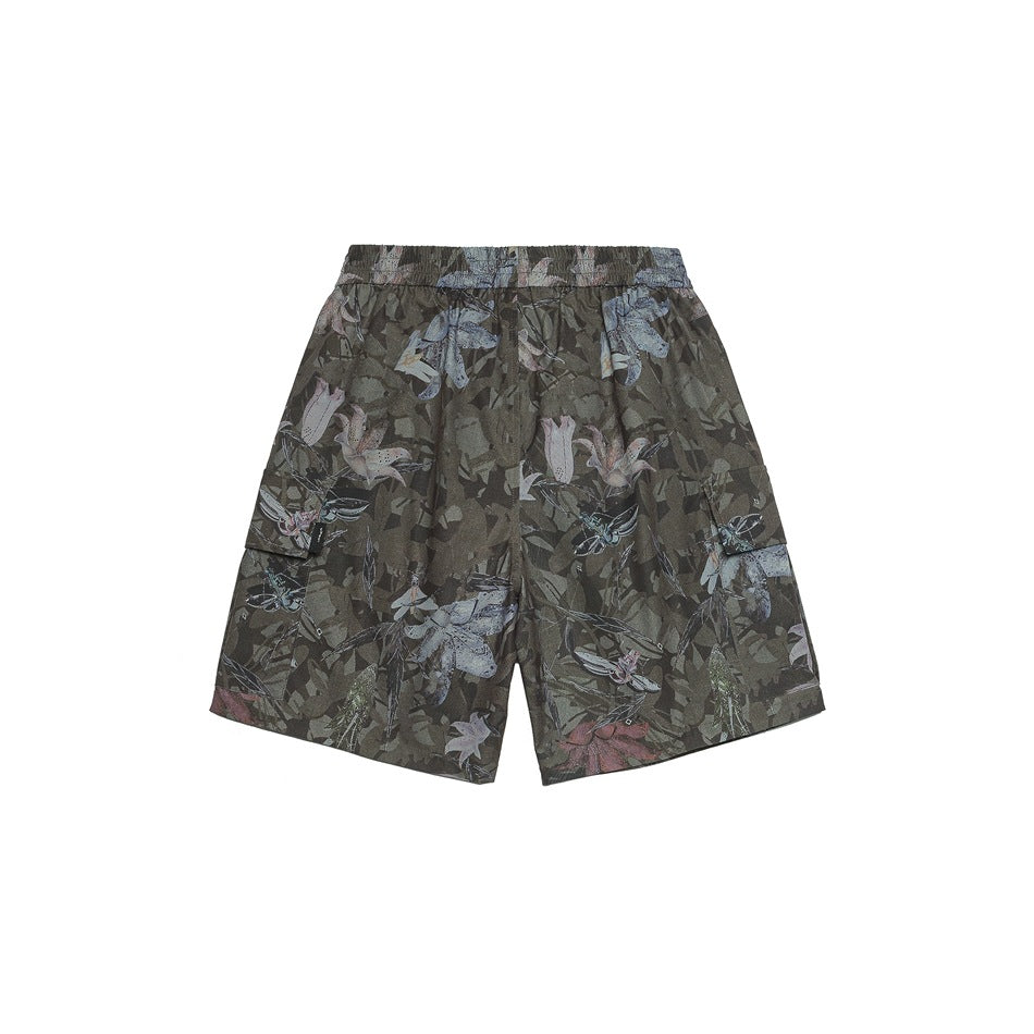 Back of green camouflage floral print shorts with elastic waistband and side cargo pockets