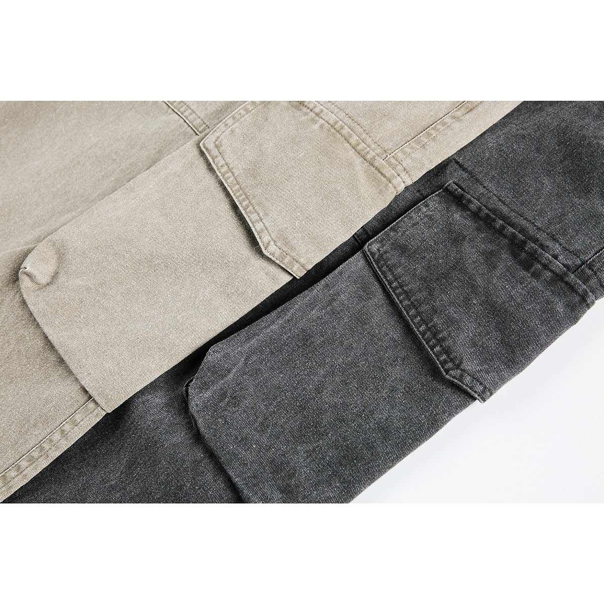 Close-up of overlapping light beige and charcoal cargo pants, highlighting their fabric and flap pockets.
