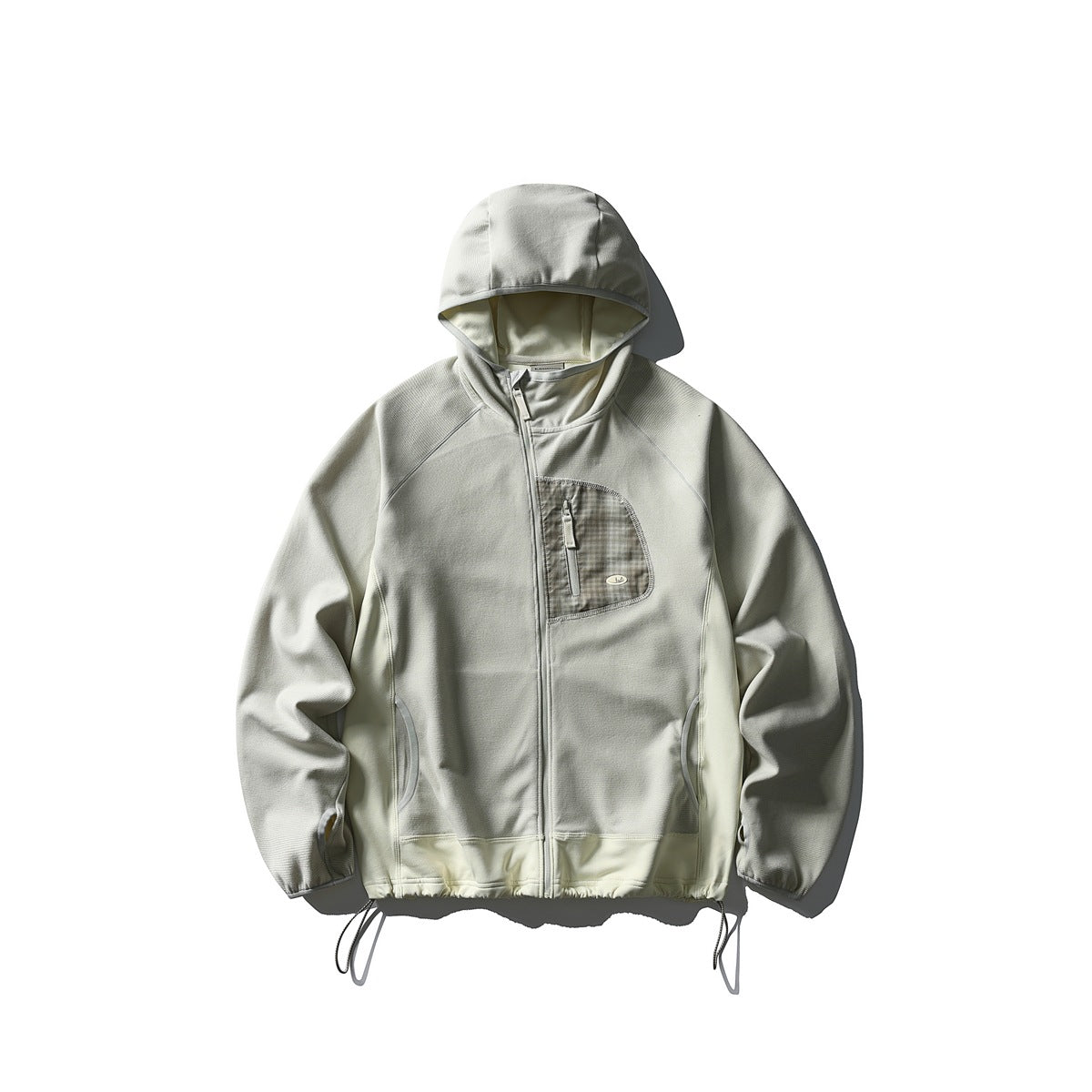 Cream yellow hooded zip jacket flat lay with plaid chest pocket and lighter side panels