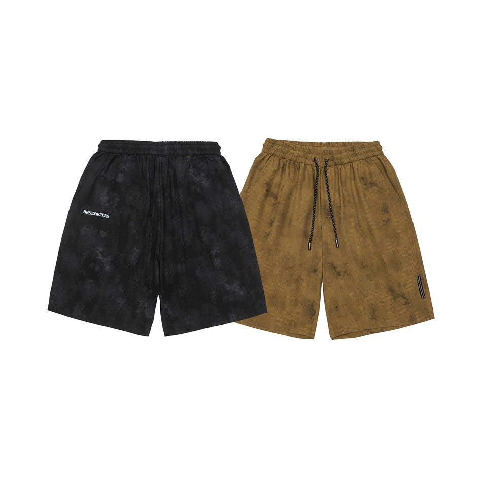 Black and ochre-brown loose-fit shorts shown side by side; the brown pair has a black drawcord.