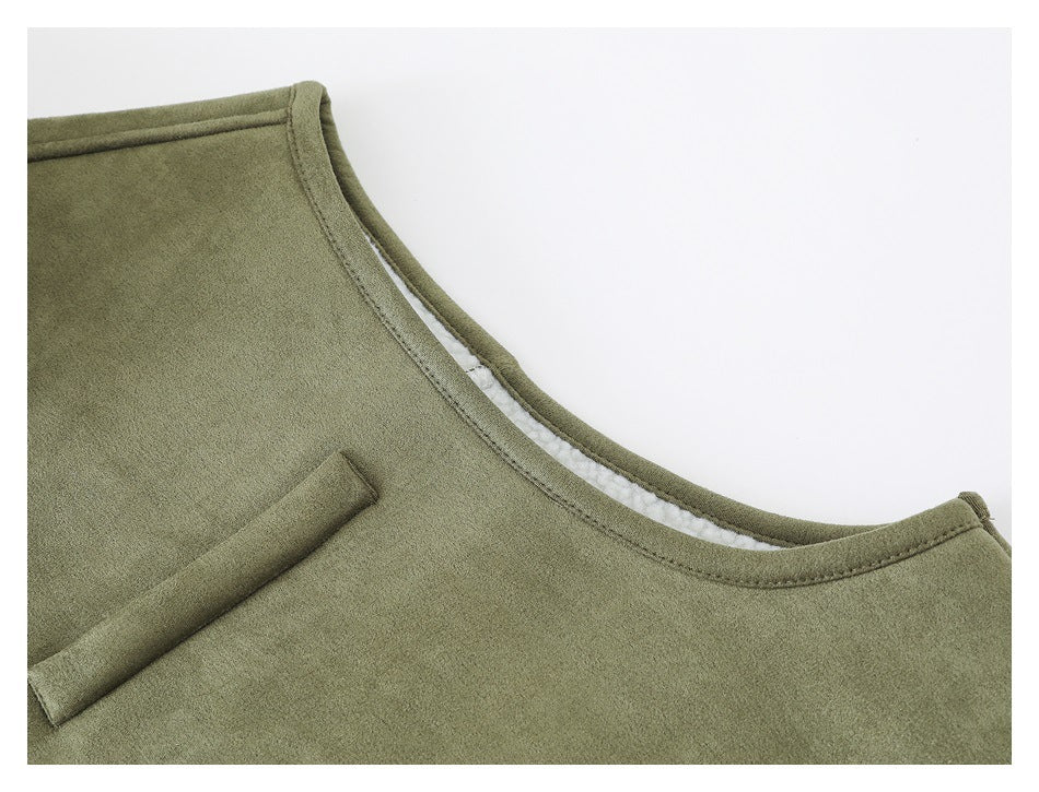 Close-up of the vest's armhole binding and chest welt pocket edge.