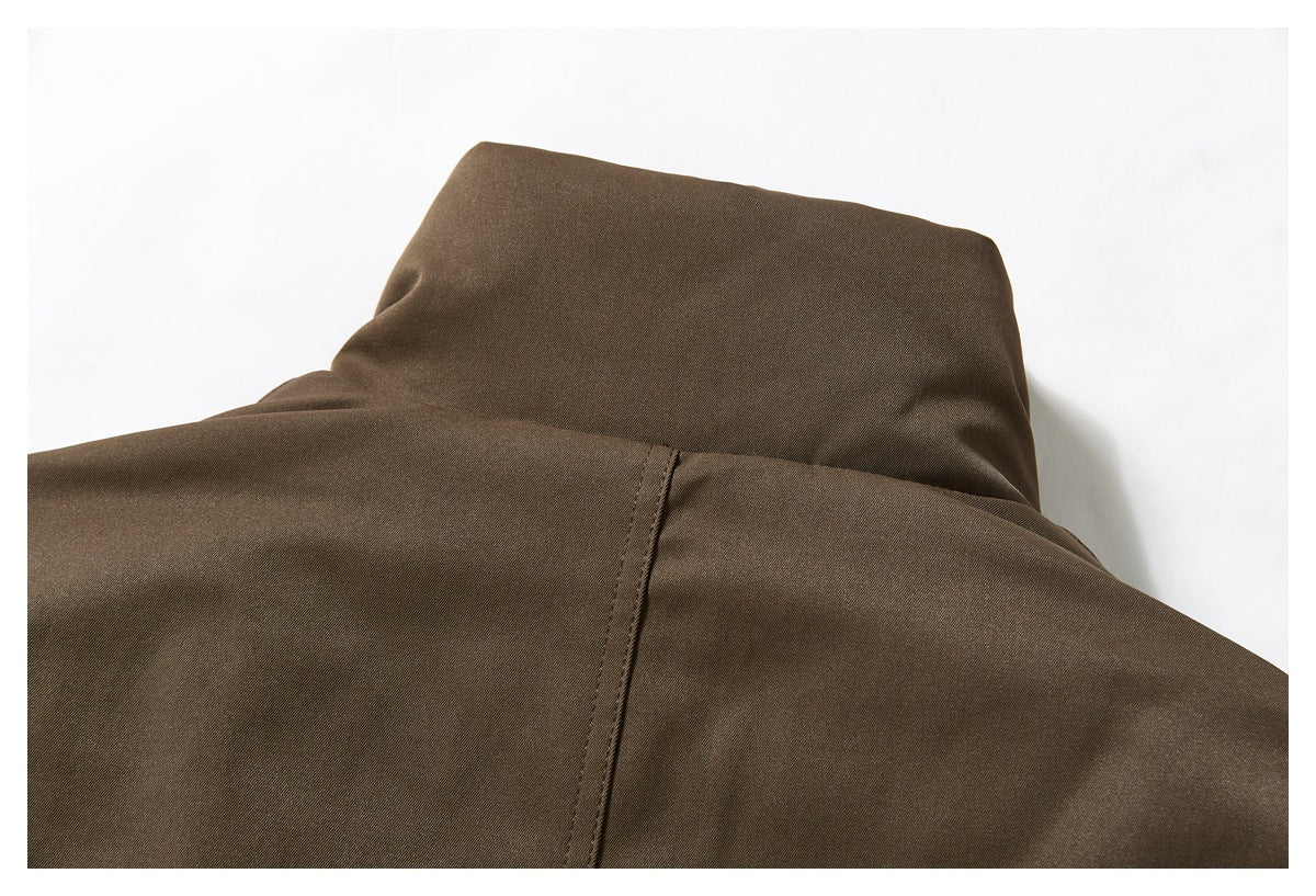 Close-up of the jacket’s back collar and central back seam.