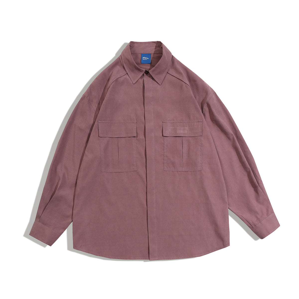Rose pink long-sleeve shirt flat lay with pointed collar, two flap chest pockets and concealed placket