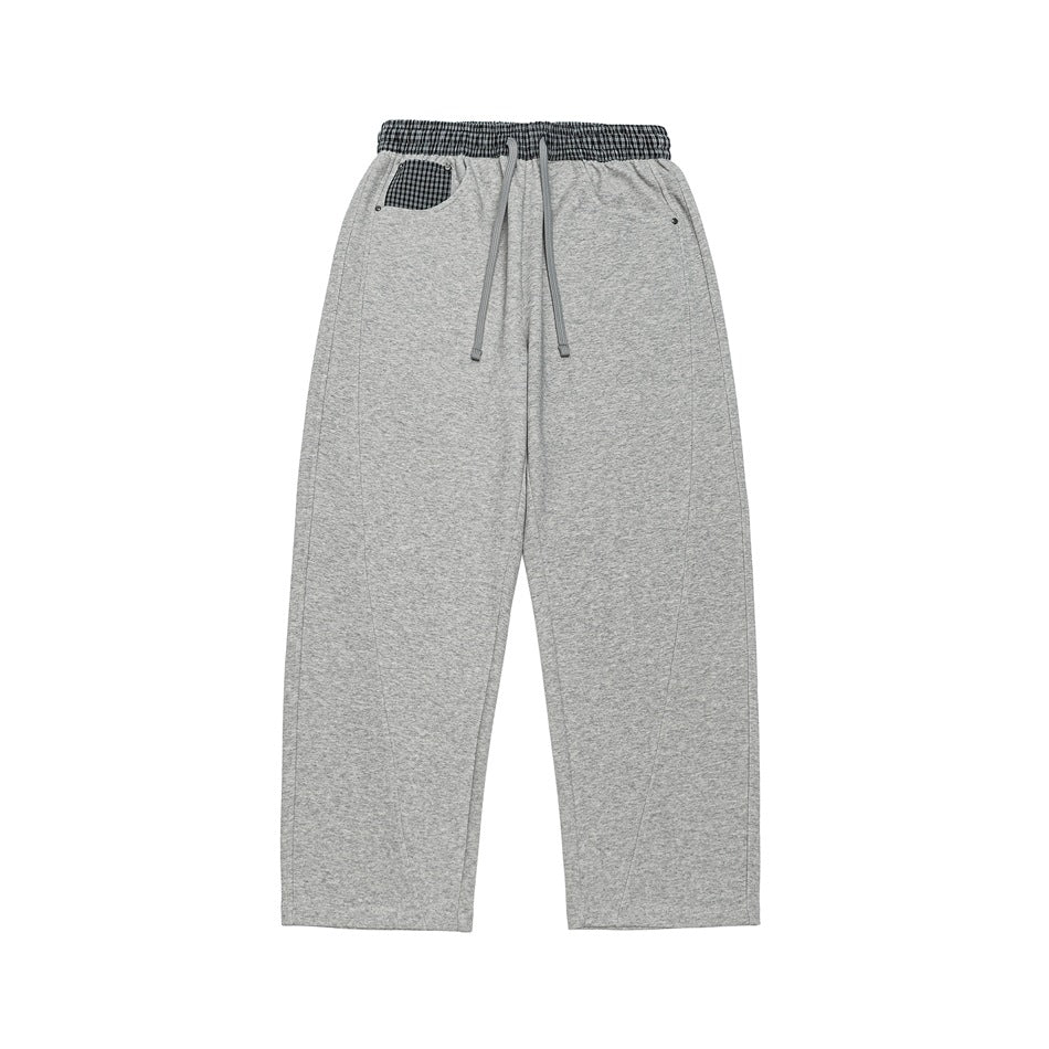 Heather gray wide-leg drawstring sweatpants with plaid waistband and plaid pocket patch, flat lay front view