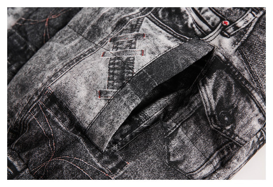 Close-up of a flap pocket on the jacket, showing its black and gray denim-print pattern and red stitching.