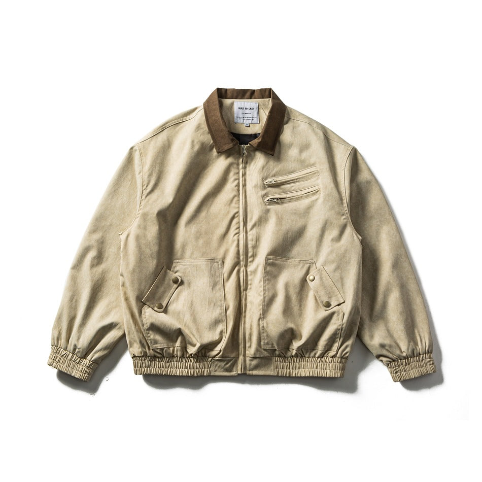 Beige zip-front jacket with brown collar, zippered chest pockets, snap flap pockets and elastic cuffs, flat lay front view