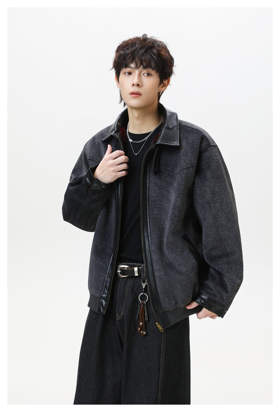 Man in gray textured zip jacket with black trim, angled view showing collar, side pocket and ribbed hem