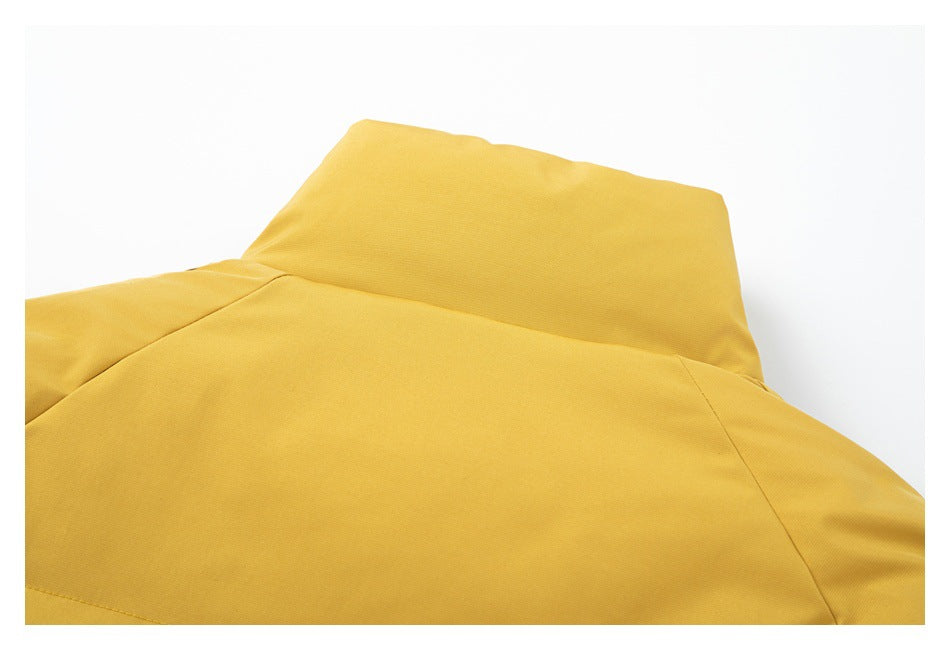 Close-up of the collar and upper back of a mustard-yellow garment.