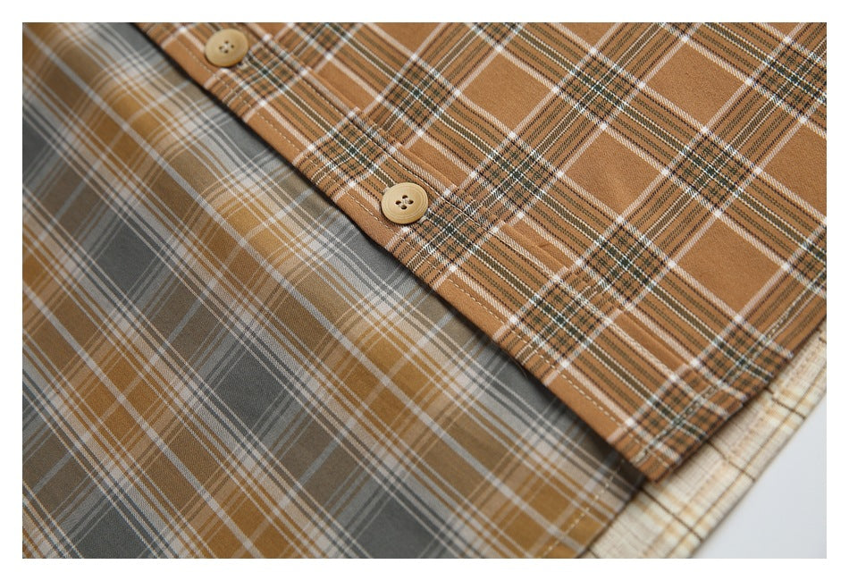 Close-up of the tan plaid front placket with tan buttons against a gray plaid shirt panel.