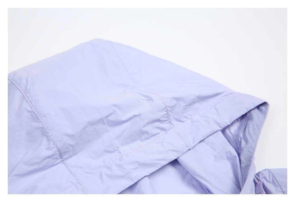 Close-up of the lavender jacket's hood, showing its panel seams and stitched edge.