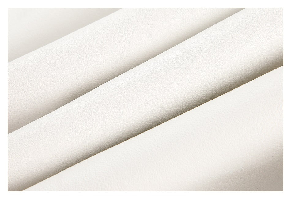 Macro view of the pebbled texture of white jacket material.