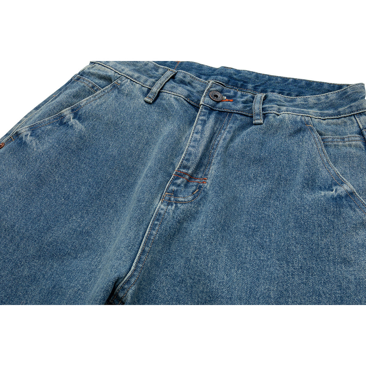 Close-up of blue jeans showing the waistband, button, belt loops, front pockets and fly.