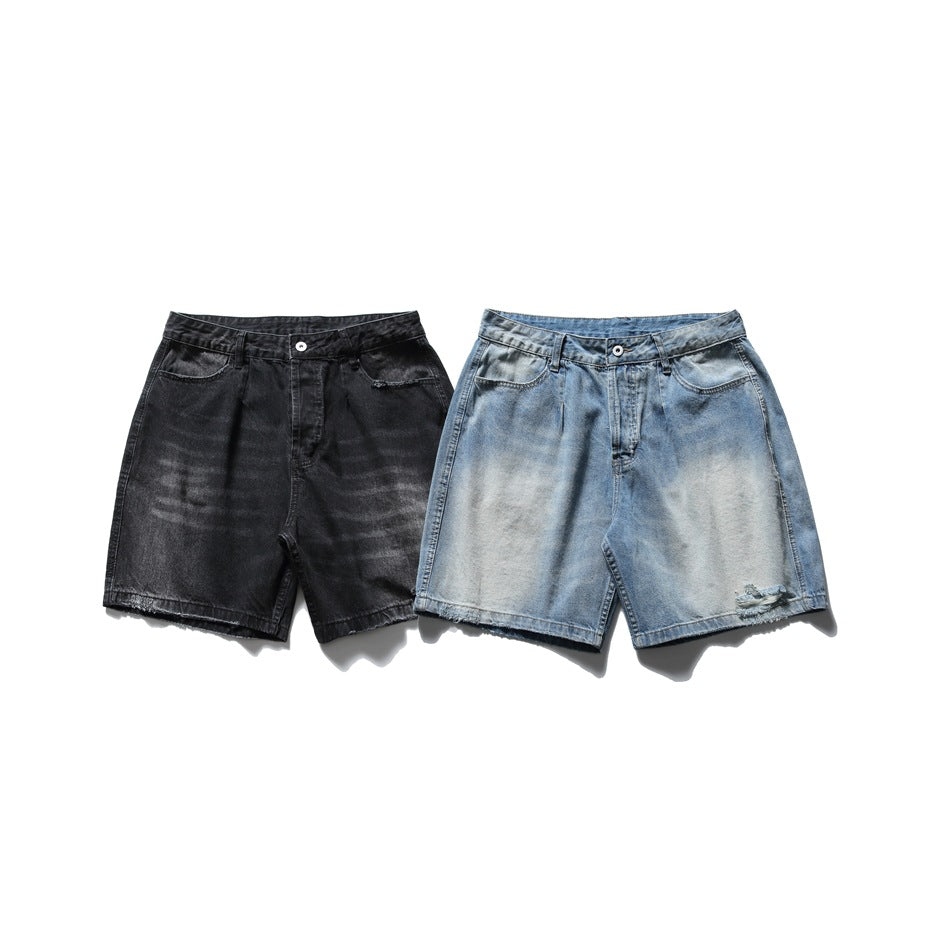 Front view of denim shorts in black and faded light blue, with a relaxed cut and distressed blue pair.