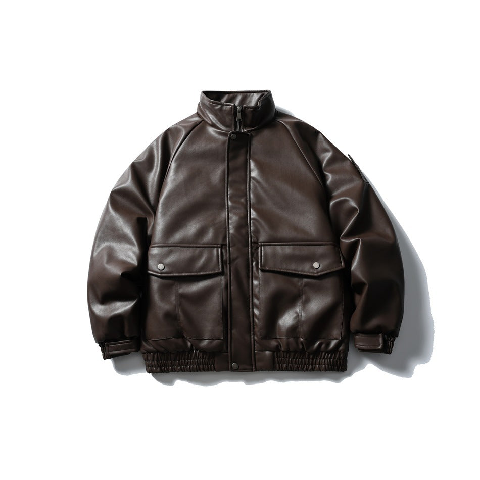 Front view of a dark brown jacket with a stand collar, snap-covered zipper, two flap pockets, and gathered hem.