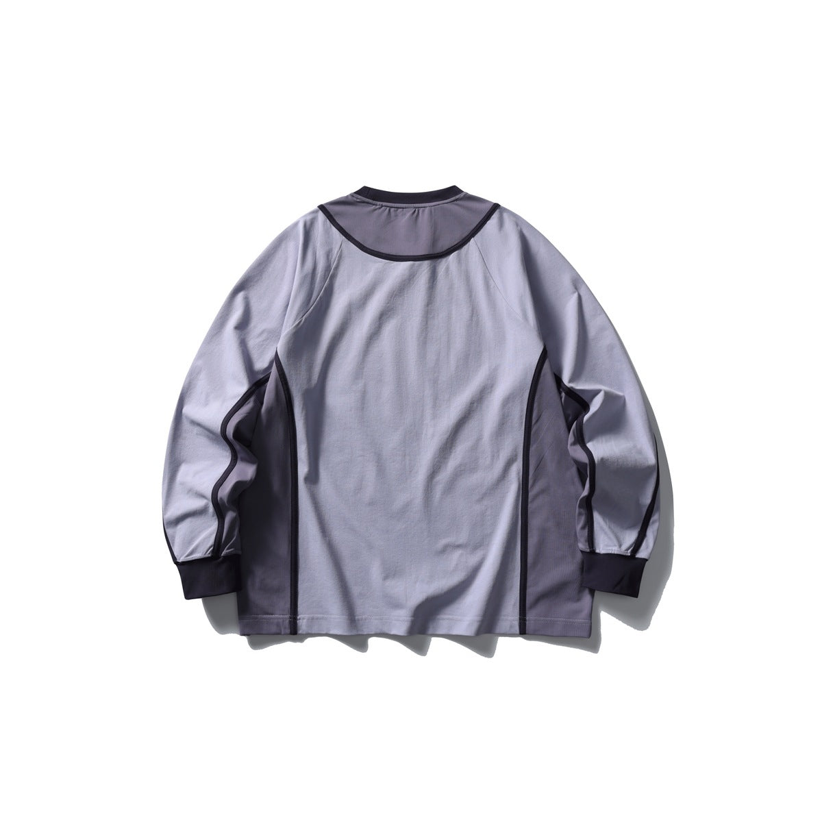 Back of a lavender-gray long-sleeve shirt with dark purple shoulder and side panels, contrast piping, and dark cuffs.