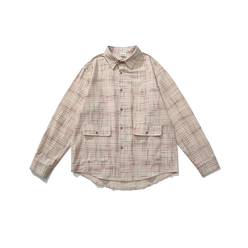 Beige plaid long-sleeve button-up shirt with two flap pockets and a curved hem, laid flat