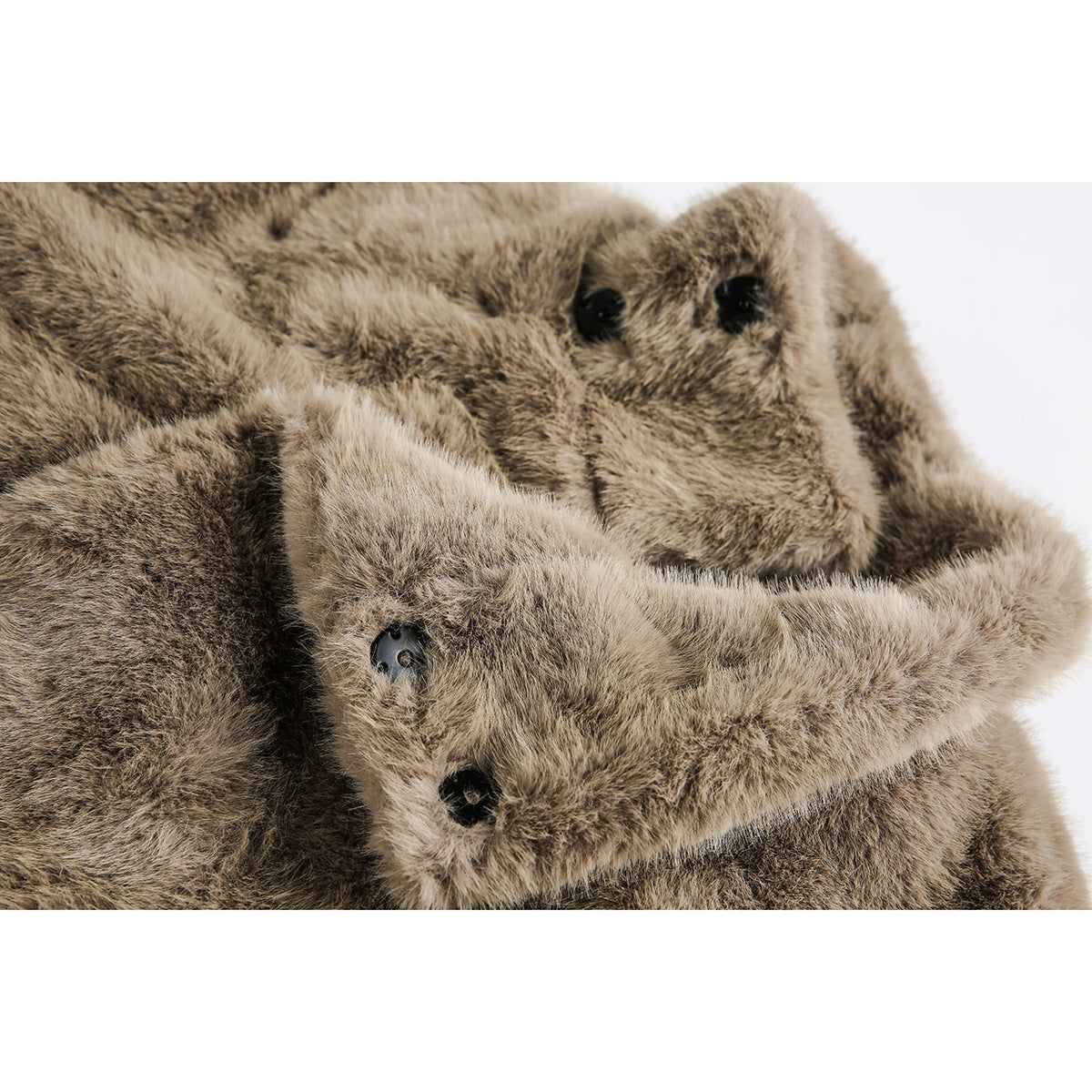 Close-up of a taupe-brown faux-fur coat collar and overlapping front edge with dark buttons.