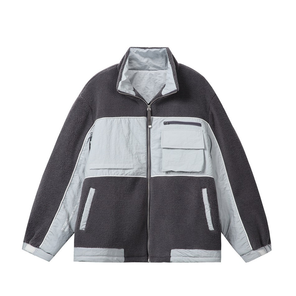 Dark gray color-block zip jacket with light gray panels, white piping, chest pockets and stand collar, flat front view