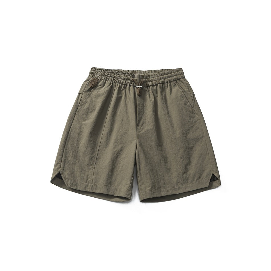 Gray khaki men's shorts flat lay, front view, with elastic drawstring waist, side pockets and curved split hem