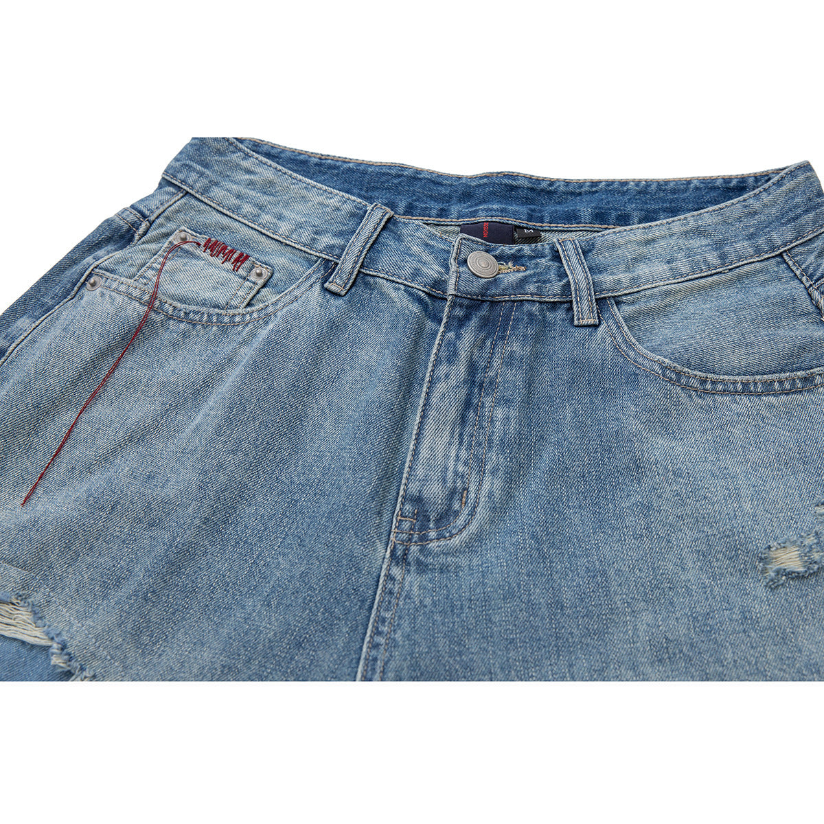 Close-up of light blue denim shorts showing the front waistband, button, pockets and red stitching.