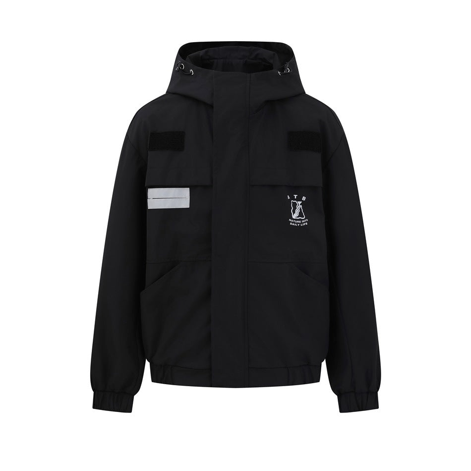 Front view of a black hooded jacket with flap and lower pockets, silver reflective strips, and a small white chest graphic.