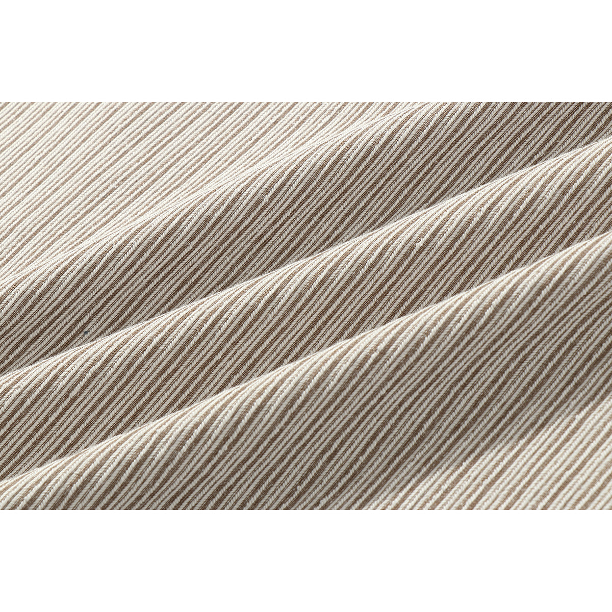 Close-up of beige and brown striped fabric arranged in soft folds.