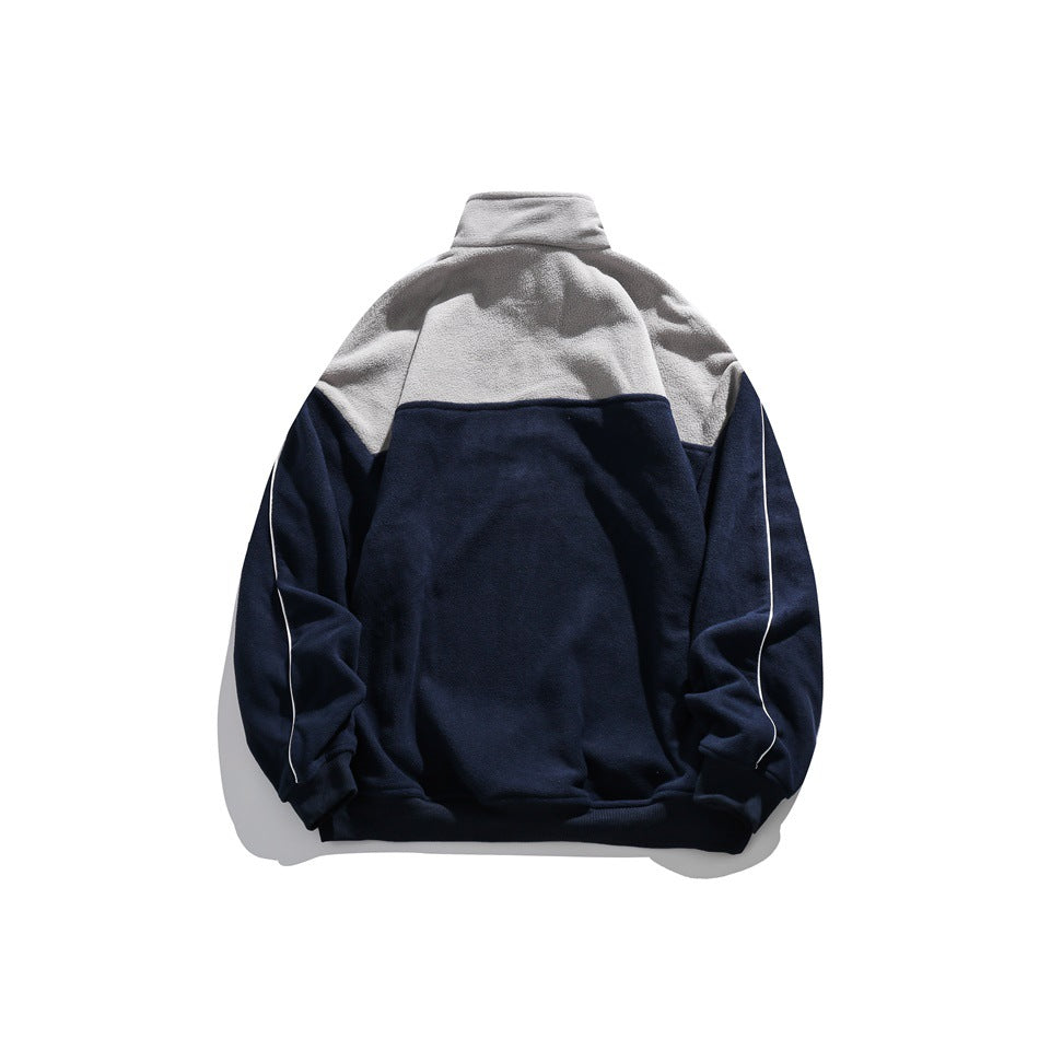 Back view of navy pullover with gray upper back yoke and collar, white piping on the sleeves