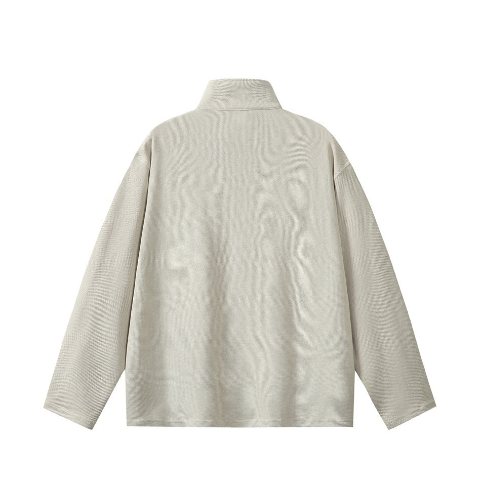 Light gray waffle-knit pullover with stand collar and drop shoulders, flat back view