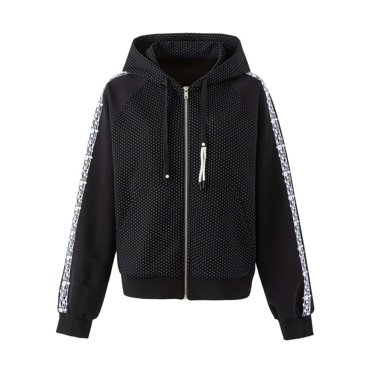 Black polka-dot zip hoodie with white music-note print sleeve stripes, front view on a white background