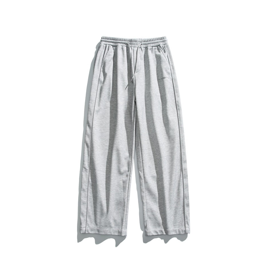 Light gray wide-leg drawstring pants with side piping, flat lay front view