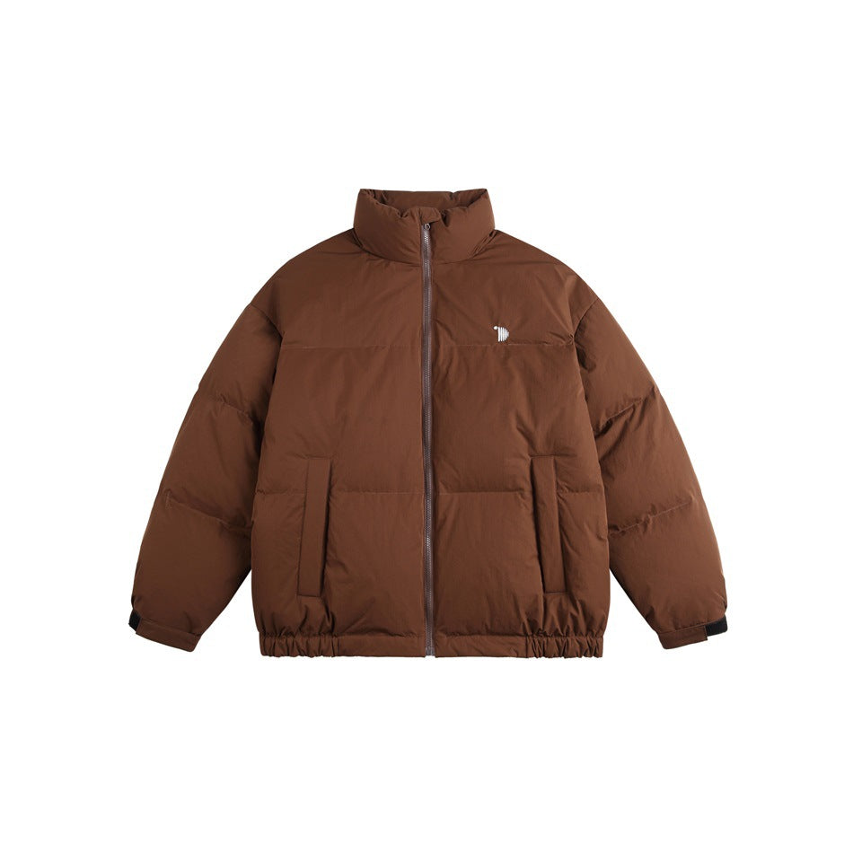 Front view of a brown padded jacket with a high collar, full-length zipper, two pockets, and a small chest emblem.